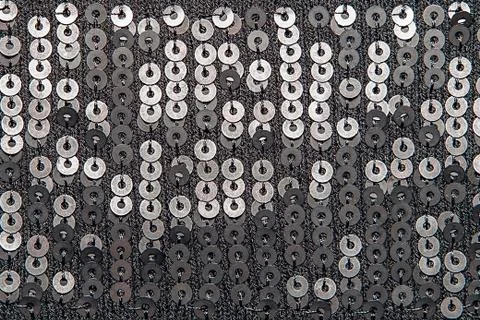 Knitted fabrics texture with sequins Stock Photos