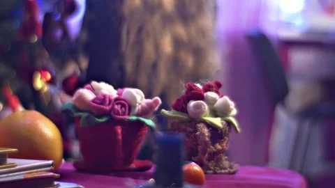 Knitted Flowers in Rag Pots Stand on a Table Stock Footage 72128981