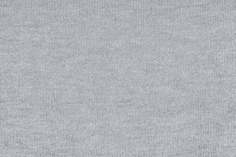 Knitted gray texture of fabric Stock Photos