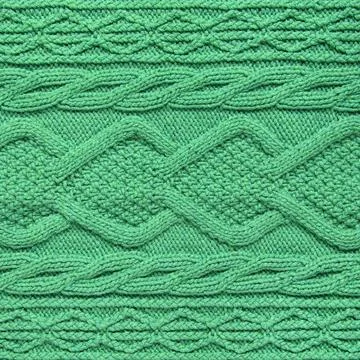 Knitted green background Stock Photos