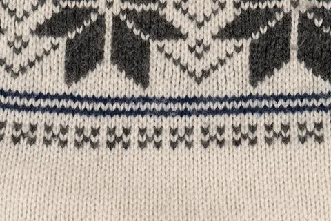 A knitted item with a pattern of squares and triangles 写真素材