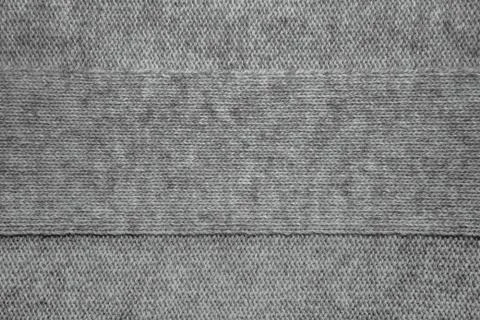 Knitted jersey background with a relief pattern Stock Photos