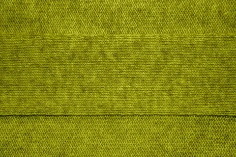 Knitted jersey background with a relief pattern Stock Photos