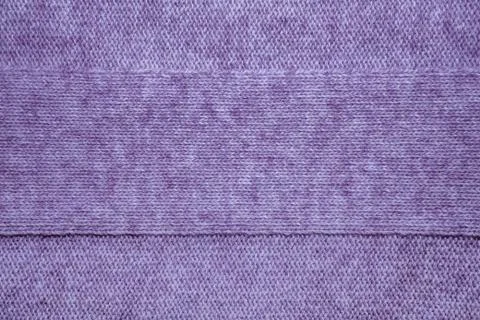 Knitted jersey background with a relief pattern Stock Photos