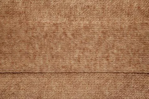 Knitted jersey background with a relief pattern Stock Photos