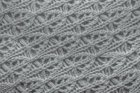 Knitted jersey background with a relief pattern Stock Photos