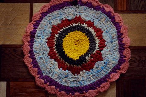 Knitted multi-colored mat made of shred Stock Photos