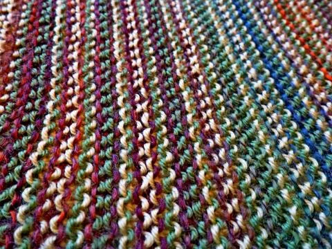 Knitted multicolored fabric texture. Background image. Hobbies, leisure, craf Stock Photos