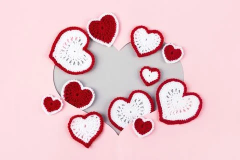 Knitted multicolored hearts Stock Photos