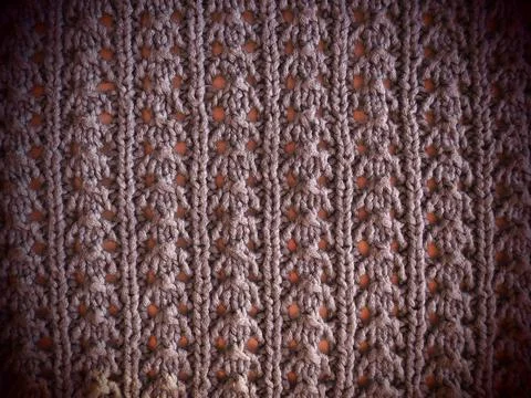 Knitted pattern of pink or red yarn. Lush machine or hand knitting. Warm ward Stock Photos