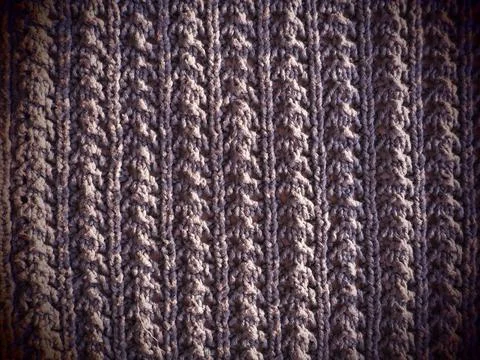 Knitted pattern of pink or red yarn. Lush machine or hand knitting. Warm ward Fotos de archivo