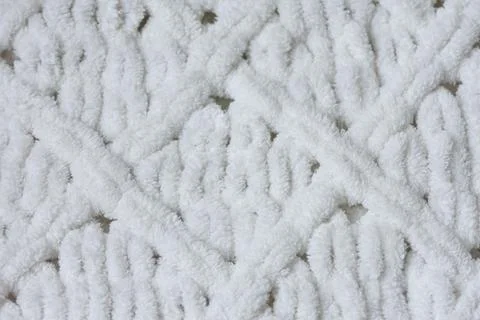 Knitted pattern rhombus from white yarn Foto stock