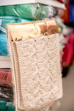 Knitted pattern on the shop window for needlework. Stock Photos