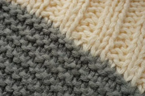 Knitted pattern of threads in two colors grey and white Stock Photos