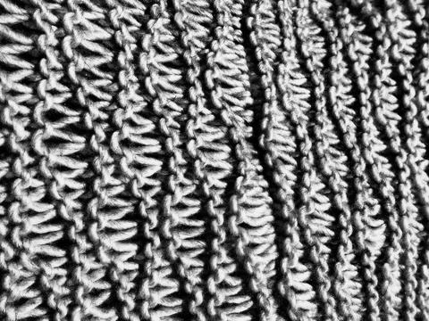 Knitted pattern of wool or acrilyc yarn. Lush machine or hand knitting. Warm  Fotos de archivo