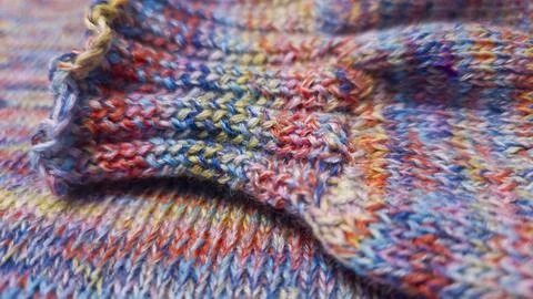 Knitted product from colored threads. Ready-made handmade women's sweater. Фото