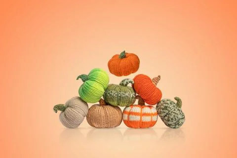 Knitted pumpkins Stock Photos