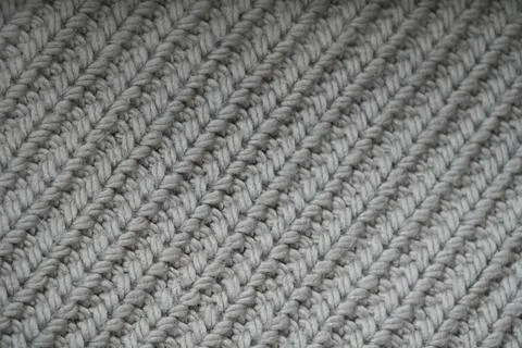 Knitted sample a close-up of neutral tone. Stock Photos