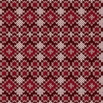 Knitted seamless pattern in red hues Stock Illustration