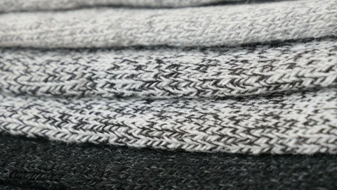 Knitted socks in different yarn string colors 4K tilting video Stock Footage 121620207