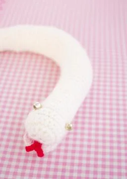 Knitted stuffed snake Stock Photos