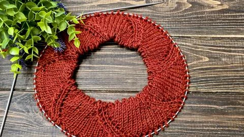 Knitted sweater collar in progress, using knitting needles and stitch markers Stock Photos