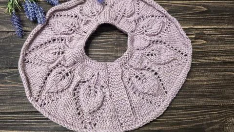 Knitted sweater collar in progress, using knitting needles and stitch markers Stock Photos
