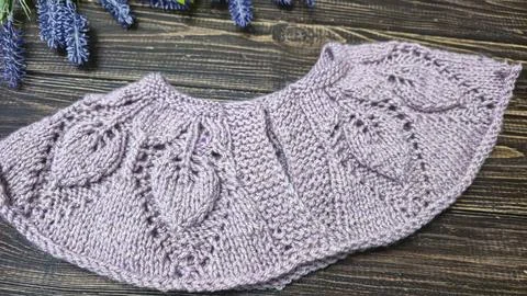 Knitted sweater collar in progress, using knitting needles and stitch markers Stock Photos
