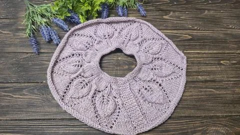 Knitted sweater collar in progress, using knitting needles and stitch markers Stock Photos