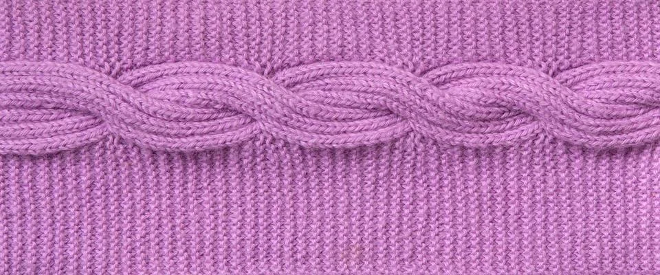 Knitted texture.  Cable knit pattern textured Stock Photos