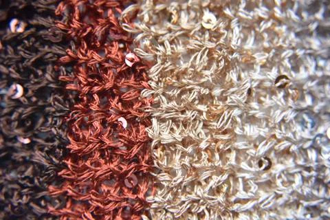 Knitted texture of fabric with sequins Stock Photos
