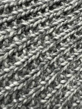 Knitted texture in gray wool pattern suitable for backgrounds or winter-the.. Stock Photos