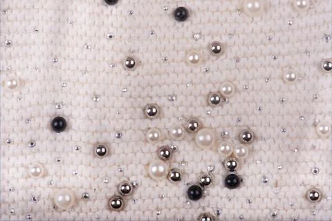 Knitted texture with multi-colored pearls. Abstract Background Photos
