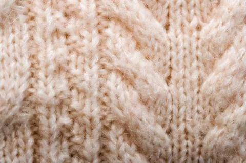 Knitted texture. Pattern fabric made of wool. Background, copy space Stock Photos