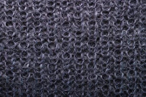 Knitted texture. Pattern fabric made of wool. Background, copy space Stock Photos