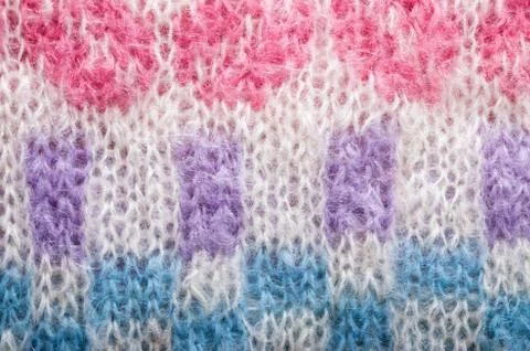Knitted texture. Pattern fabric made of wool. Background, copy space Stock Photos