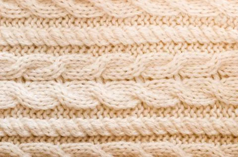 Knitted texture. Pattern fabric made of wool. Background, copy space Stock Photos