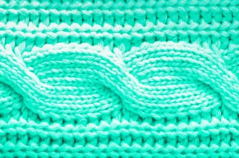 Knitted texture. Pattern fabric made of wool in mint color. Background, copy Stock Photos