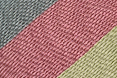 Knitted textured surface with colored stripes diagonally Stock-Fotos