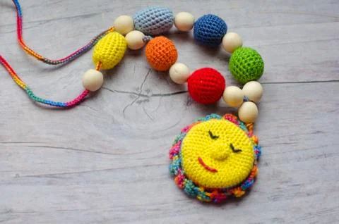 Knitted toy for develop of newborn baby's motility Foto stock