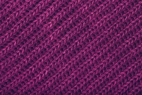 Knitted violet scarf texture Stock Photos
