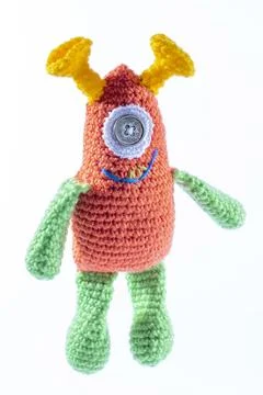 Knitted wool alien on a white background Stock Photos