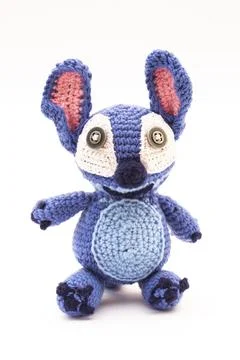 Knitted wool alien on a white background Stock Photos