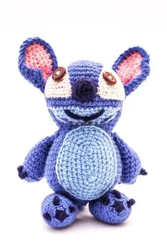 Knitted wool alien on a white background Stock Photos