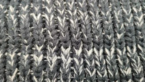 Knitted wool background made of melange yarn Stock Photos