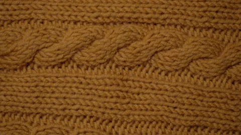 Knitted Wool background. Merino wool ocher color, macro shoot. Woolen fabric Stock Footage 138877284