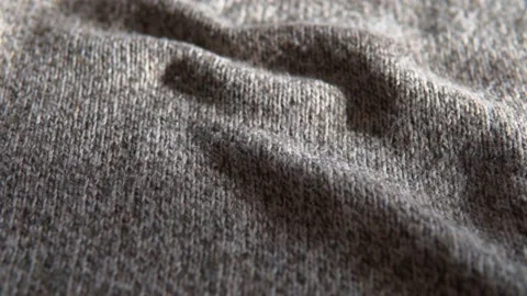 Knitted wool background. Soft, grey, woolen clothes texture, fabric sweater Stock Footage 169425625