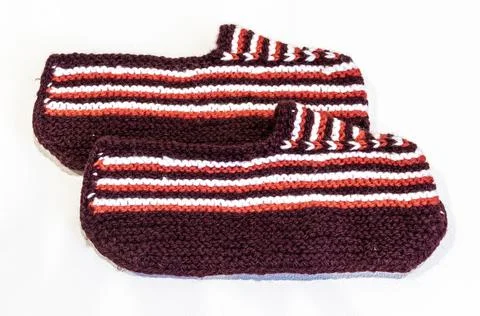 Knitted wool slippers Stock Photos