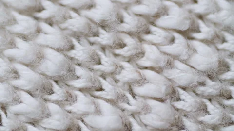 Knitted wool texture that shrinks and stretches. Top view, close-up Stock Footage 243565214