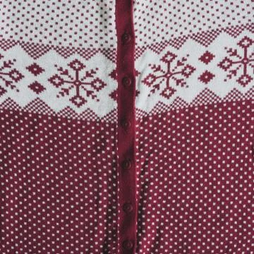 Knitted woolen background. white background with red knitted Norwegian pattern. Stock Photos